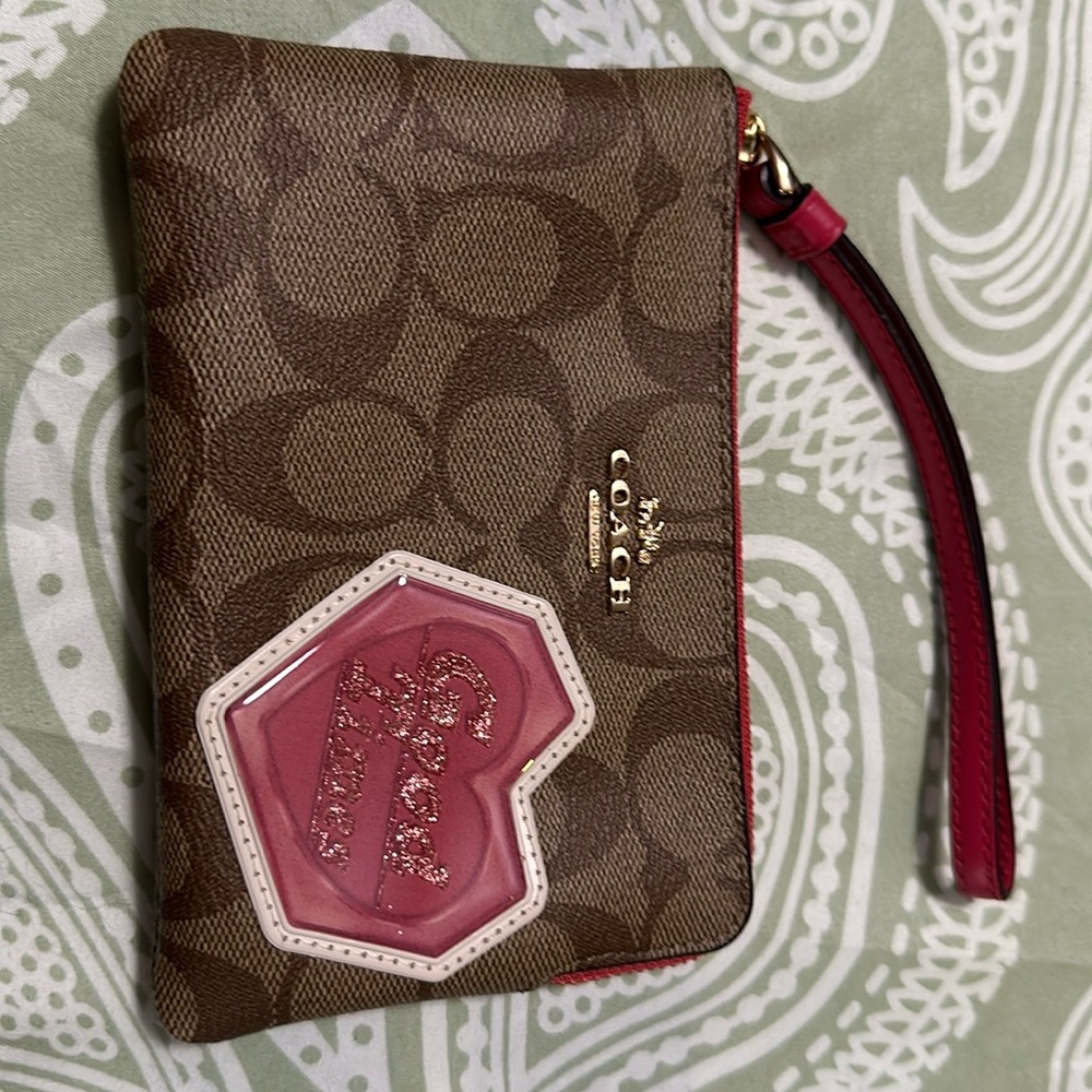 Authentic COACH Signature coated canvas/leather heart( good times) zip wristlet